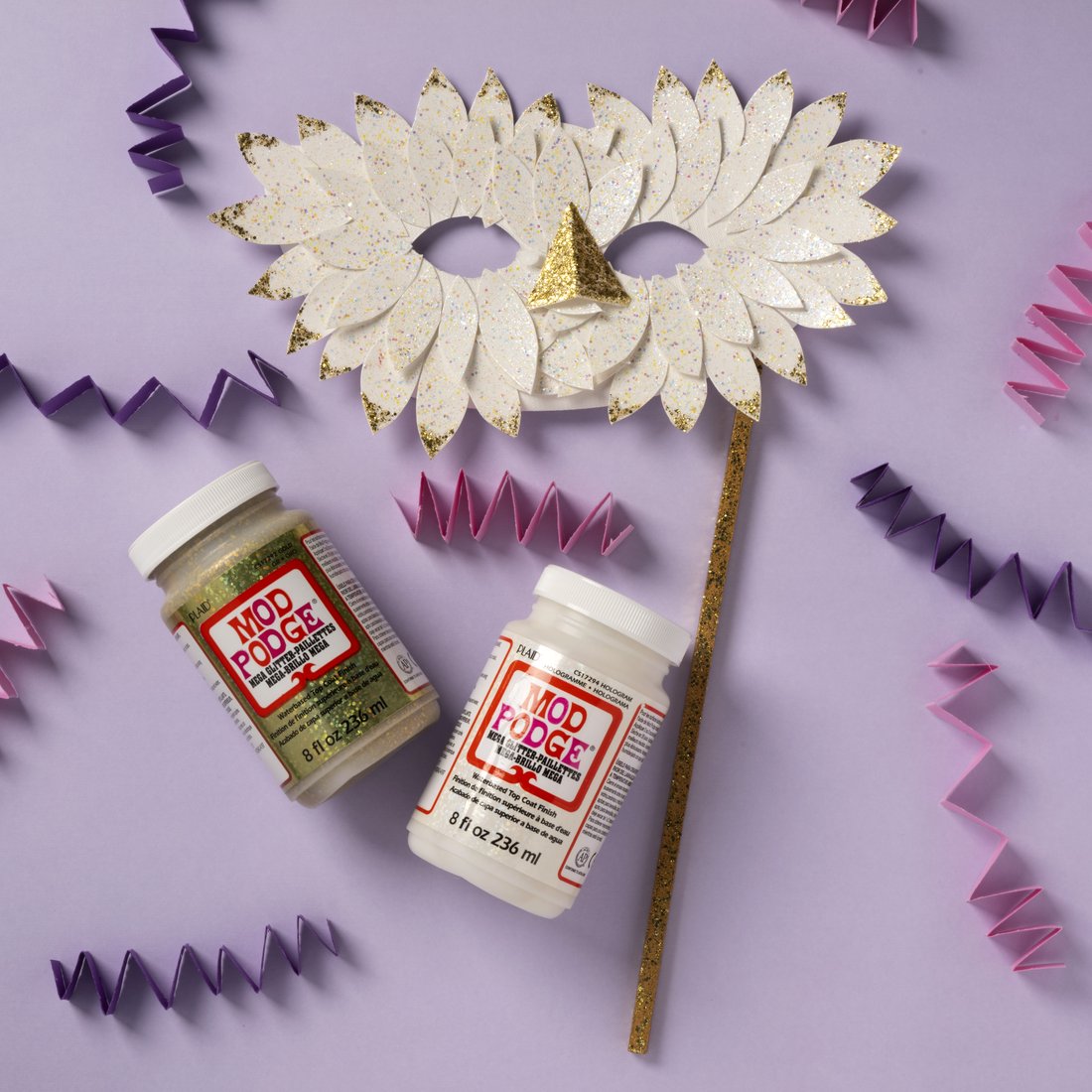 A paper flower mask made with Mod Podge